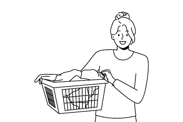 mujer sonriente, con, cesta de la ropa sucia