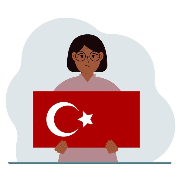 Una mujer sostiene una bandera turca en sus manos Concepto de demostración fiesta nacional Día de Turquía o patriotismo Nacionalidad