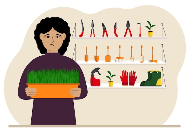 Una mujer sostiene una planta en sus manos contra el fondo de herramientas de jardinería Concepto de jardinería