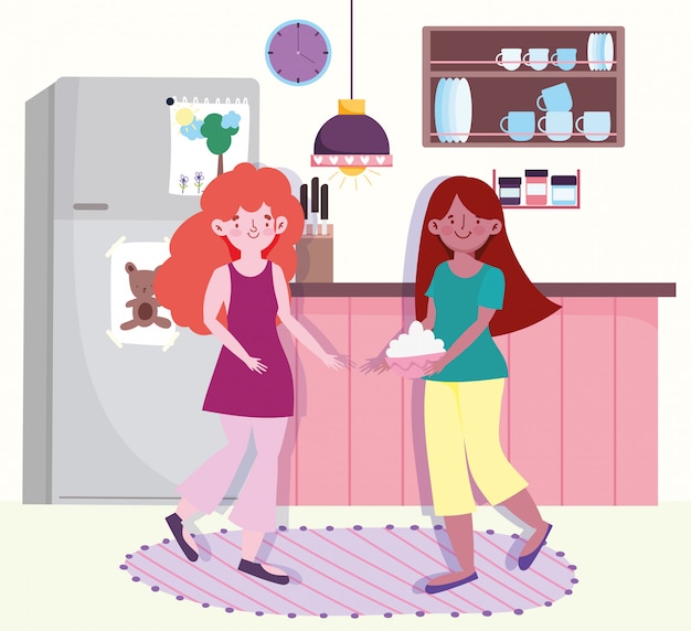 Mujeres haciendo comida con tazón en la cocina