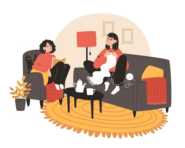 Las mujeres jóvenes se relajan juntas haciendo sus pasatiempos en una casa acogedora con un gato