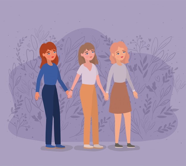 Mujeres tomados de la mano en el parque y las hojas