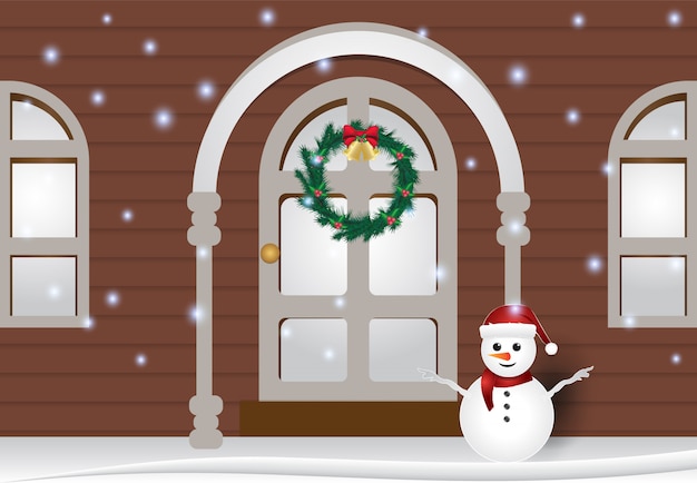 Muñeco de nieve frente a la ilustración de invierno de la casa
