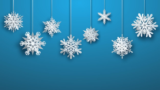 Navidad gran papel complejo colgando copos de nieve sobre fondo azul claro