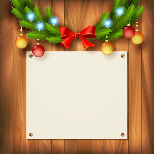 Navidad de madera con una hoja de papel en blanco