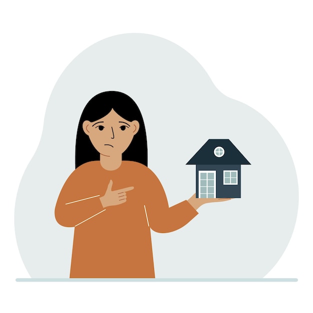 Una niña pequeña tiene una pequeña casa en la palma de su mano Conceptos de herencia o transferencia de bienes raíces a los niños
