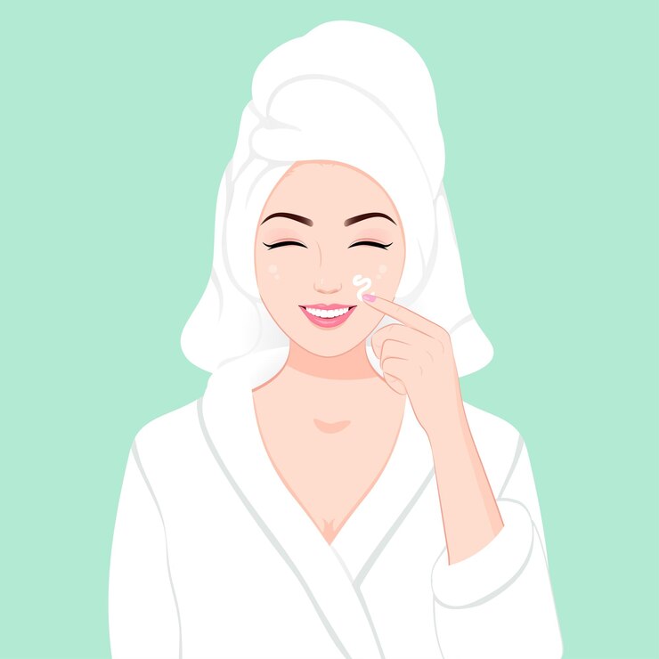 Niña sonriente aplicando crema facial diaria en albornoz cuidado de la piel concepto de salón de spa de belleza natural