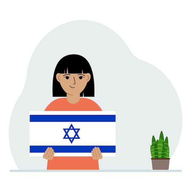 Una niña sostiene la bandera de Israel en sus manos El concepto de fiesta nacional de demostración o patriotismo Nacionalidad