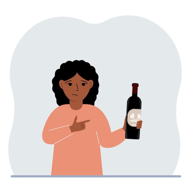 Una niña sostiene una botella de vino en la mano El concepto de abuso de alcohol adicción al alcohol por parte de menores