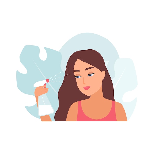 Niña usando un spray para aplicar un producto cosmético líquido en el cabello