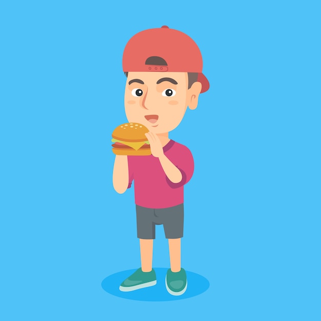 Niño caucásico comiendo una hamburguesa.