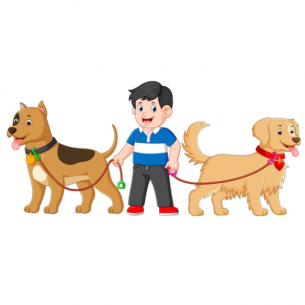 un niño está parado entre dos perros grandes y lindos y usa una camisa azul