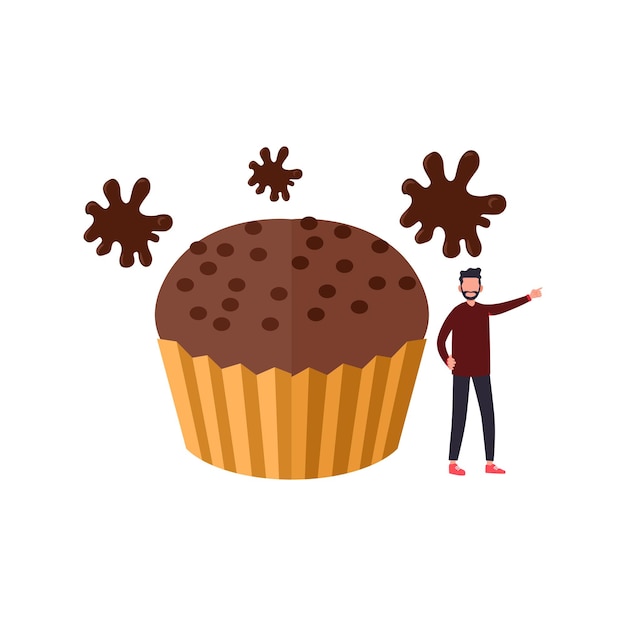 El niño está de pie junto al muffin de chocolate