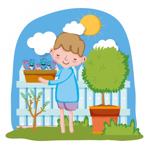 Niño levantando planta de interior con valla y árbol