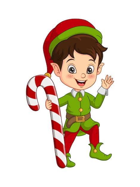 Niño lindo en traje de duende navideño sosteniendo un bastón de caramelo