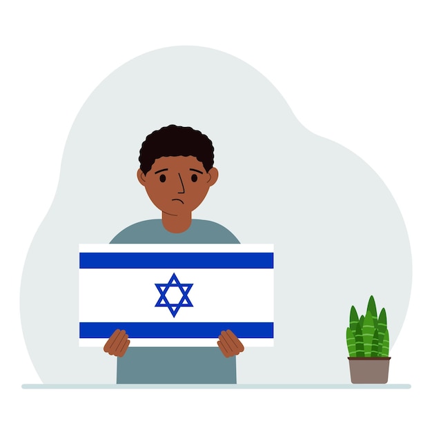 Un niño pequeño sostiene la bandera de Israel en sus manos El concepto de fiesta nacional de demostración o patriotismo Nacionalidad