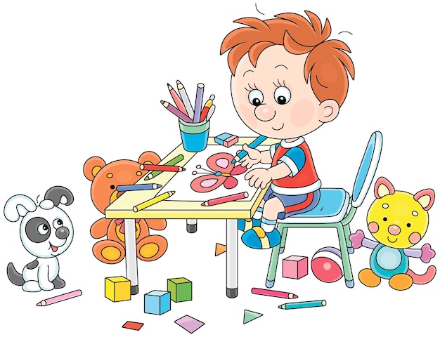 Un niño sonriente sentado en su mesa y dibujando con lápices de color un cuadro gracioso