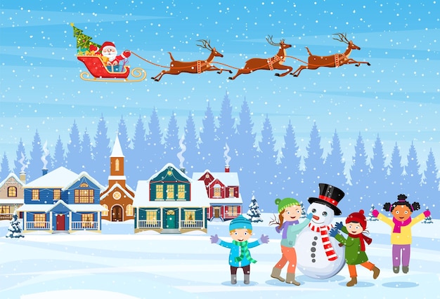 Niños construyendo muñeco de nieve.