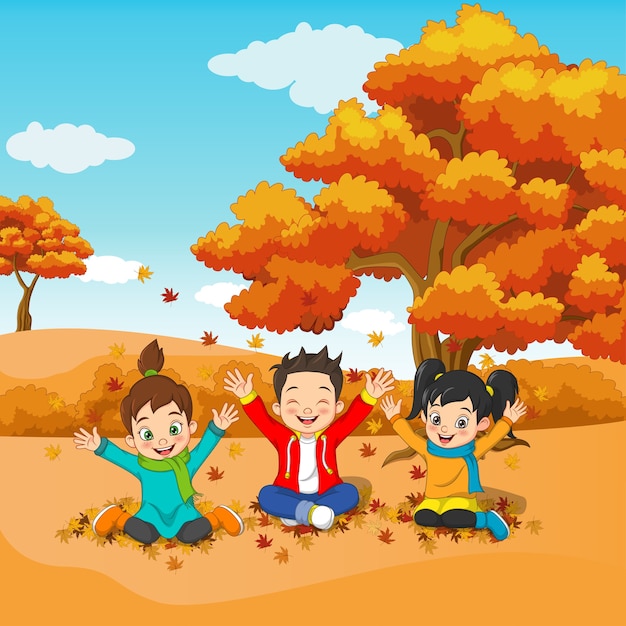 Niños felices de dibujos animados jugando en el fondo de otoño