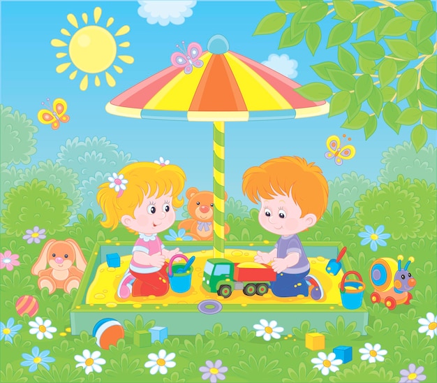 Niños pequeños jugando en una caja de arena en un patio de recreo en un parque en un día soleado de verano