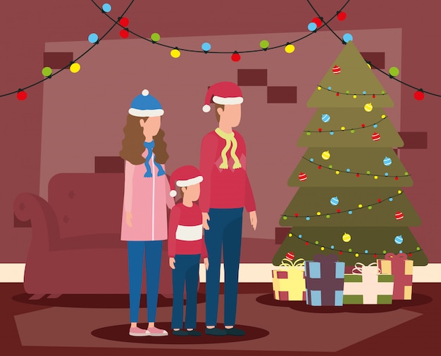 padres e hijo celebrando la navidad en el salón con árbol