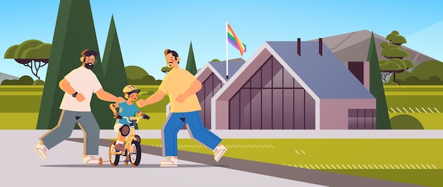 Padres varones enseñando a su hijo pequeño a andar en bicicleta familia gay transgénero amor concepto de comunidad lgbt