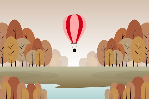 Paisaje de bosque otoñal con ilustración de globo rojo