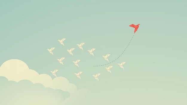 Pájaro rojo cambiando de dirección y los blancos. Nueva idea, cambio, tendencia, coraje, solución creativa, negocio, innovación y concepto de forma única.