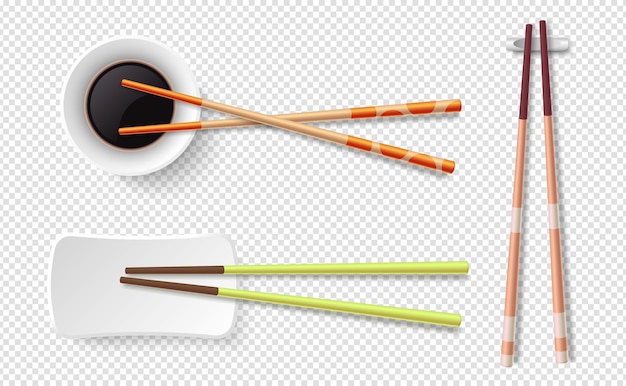 Palillos. Palitos de sushi de madera de colores, placa con salsa de soja.