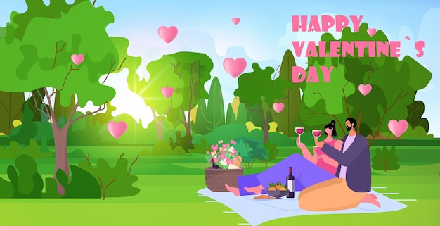 Pareja amorosa celebrando feliz día de san valentín en el parque hombre mujer enamorada bebiendo vino fondo de paisaje