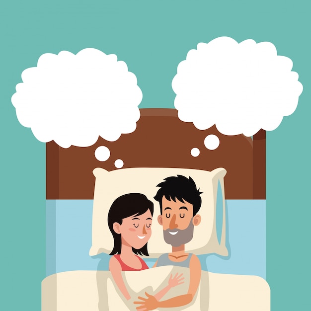 Pareja durmiendo en la cama soñando abrazando feliz