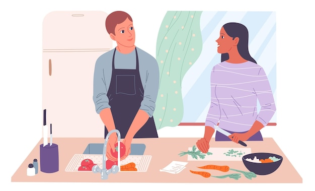 Pareja joven cocinando en casa El hombre lava las verduras la mujer las corta
