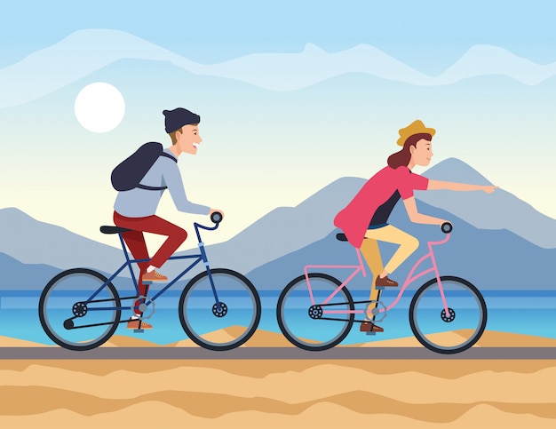 Pareja joven viaja en bicicleta