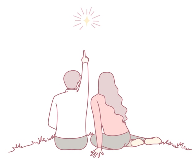 Una pareja que disfruta de un hermoso y brillante momento estrellado juntos bajo el cielo