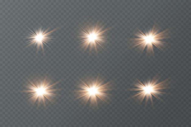 Partículas doradas de luz. Luz dorada. Llamarada de luz. Estrellas aisladas sobre fondo transparente.