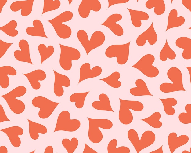 El patrón sin costuras de corazón rojo en fondo rosa infunde a sus diseños amor y energía apasionada