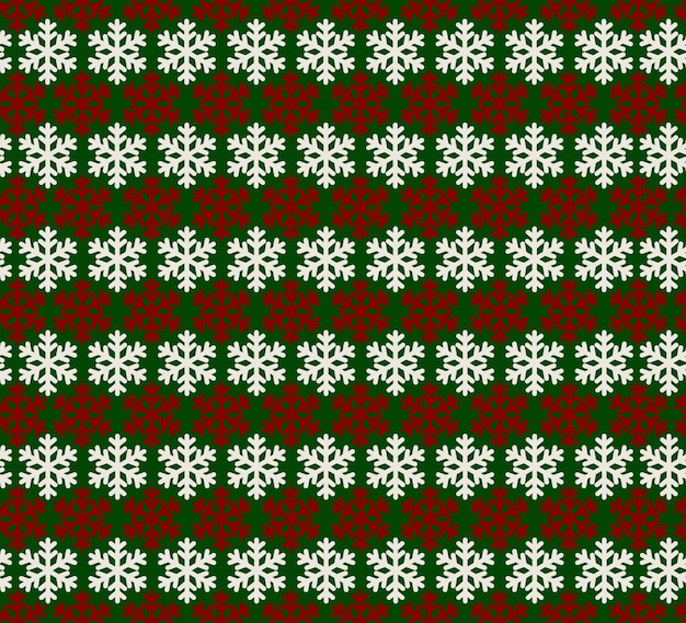 Patrón sin fisuras de copos de nieve rojos y blancos sobre un fondo verde