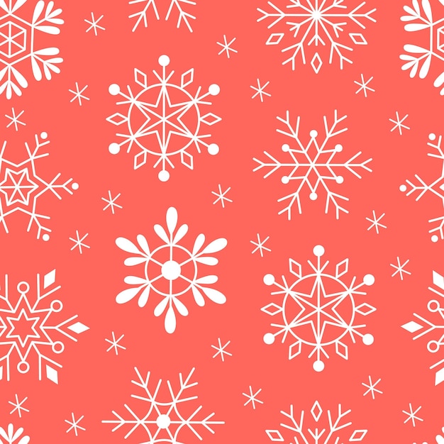 Patrón sin fisuras de copos de nieve sobre un fondo rojo.