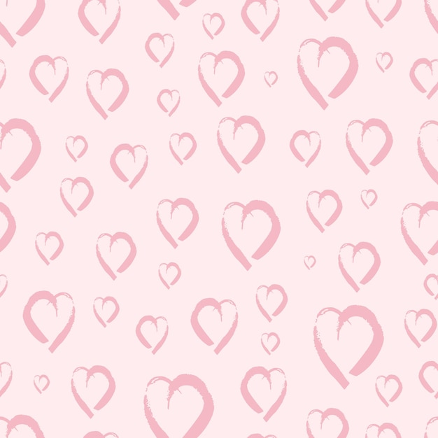 Patrón sin fisuras con corazones dibujados a mano. Doodle grunge rosa corazones sobre fondo de color rosa. ilustración vectorial