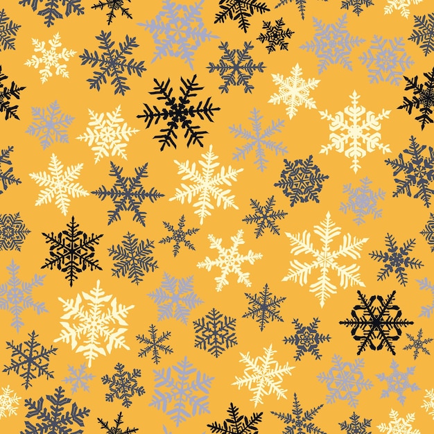 Patrón sin fisuras de Navidad con copos de nieve grandes y pequeños complejos de color sobre fondo amarillo