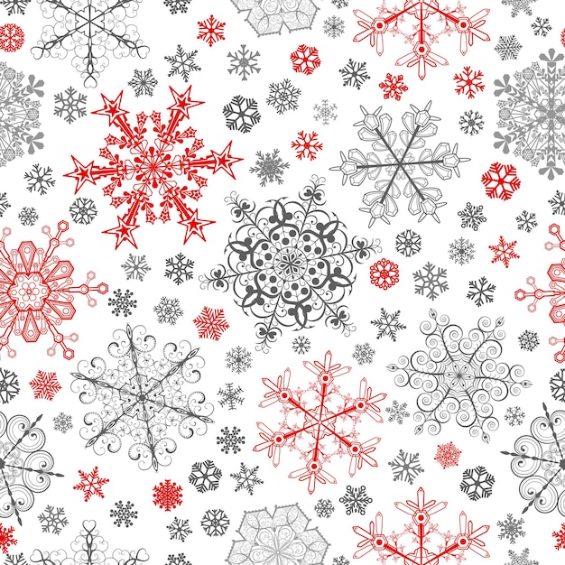 Patrón sin fisuras de Navidad de copos de nieve grandes y pequeños rojos y grises sobre blanco