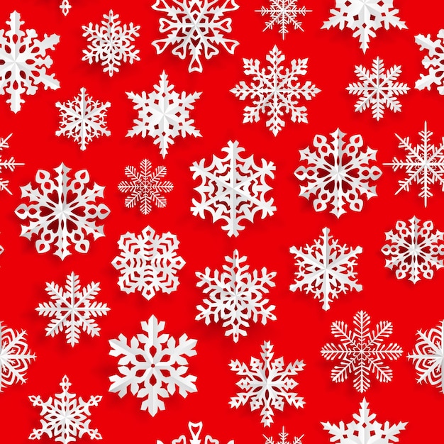 Patrón sin fisuras de Navidad con copos de nieve de papel blanco sobre fondo rojo