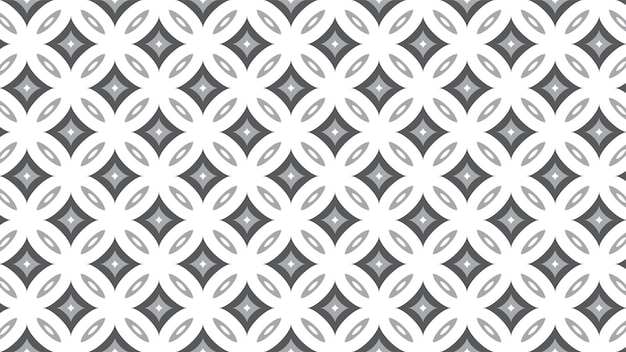Un patrón geométrico abstracto con formas blancas en contraste con un papel tapiz de textura gris