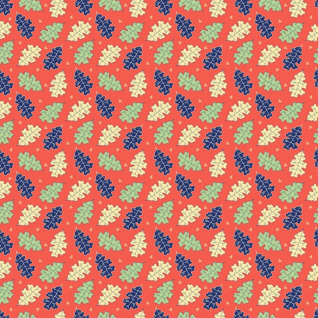 Un patrón impecable con hojas azules y verdes sobre un fondo rojo.