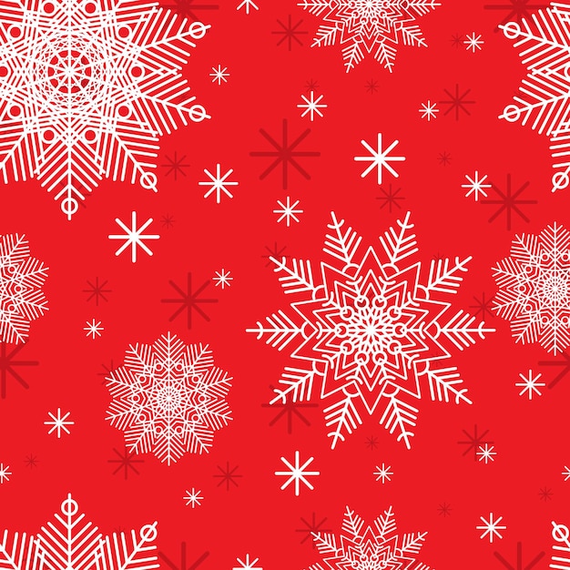 Patrón de Navidad con copos de nieve blancas sobre un fondo rojo.