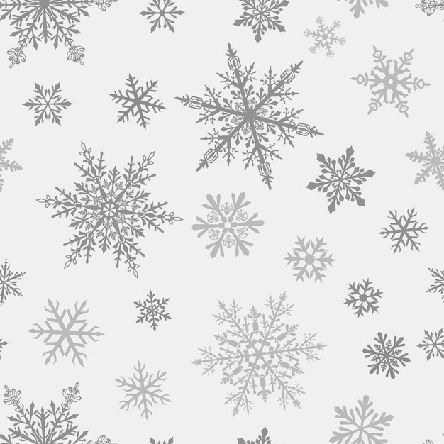 Patrón navideño sin fisuras de complejos copos de nieve grandes y pequeños en colores grises sobre fondo blanco