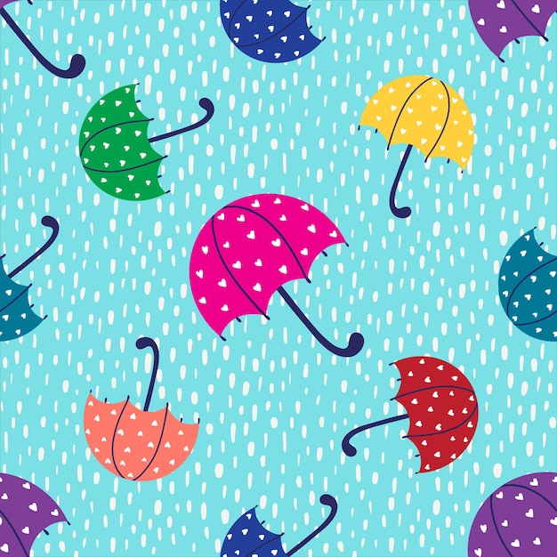 Vector patrón con un paraguas multicolor y gotas de lluvia sobre un fondo azul.