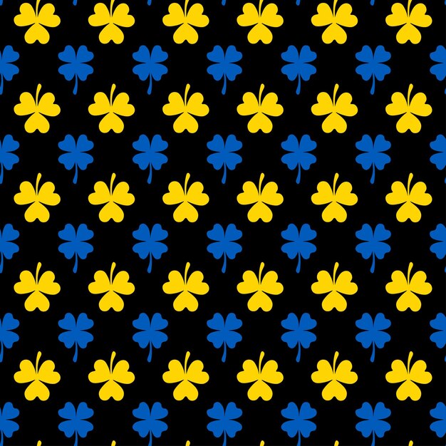 Patrón transparente de trébol amarillo y azul con fondo negro. Patrón sin fisuras de trébol.