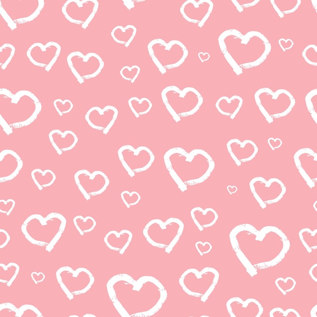 Patrones sin fisuras con corazones dibujados a mano. doodle corazones de grunge blanco sobre fondo rosa. ilustración vectorial.