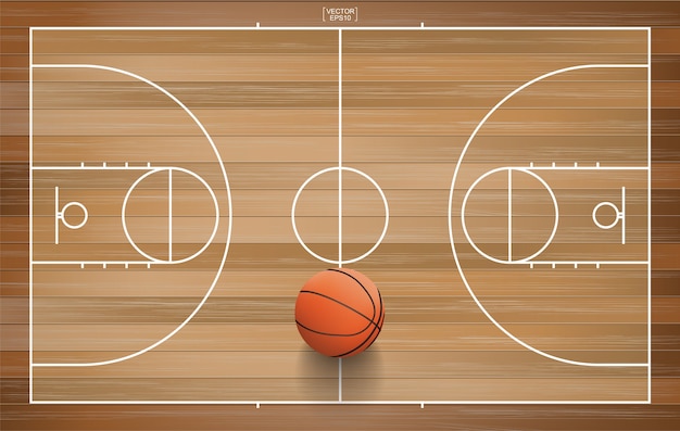 Pelota de baloncesto en la cancha de madera.